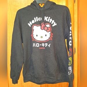 A Hello Kitty Tokyo black graphic hoodie. PTP 22"